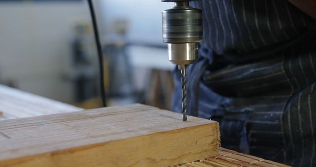 Carpenter Drills Wood on Workbench for Precision Work - Download Free Stock Images Pikwizard.com