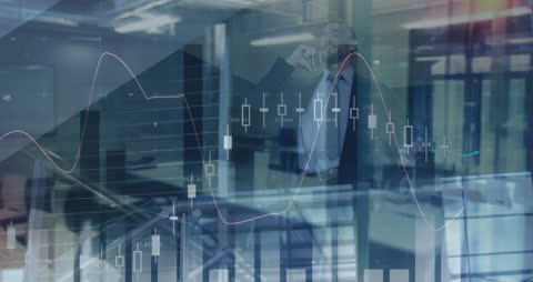 Financial Data Overlaid on Businessman Making Phone Call