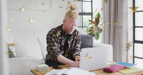Diligent Man Working from Home with Flying Stars