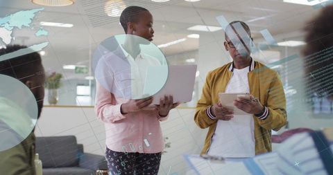 Data-Focused Diverse Colleagues Collaborating in Modern Office