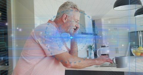 Senior Man Talking on Phone and Typing on Laptop at Kitchen Island with Holographic Tech Overlay