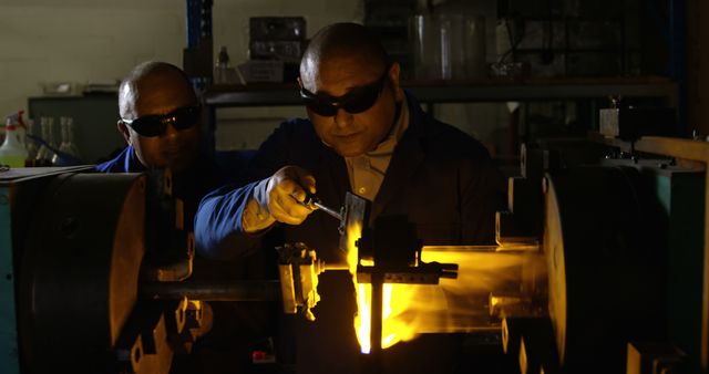 Engineers Wearing Protective Glasses Working with Industrial Equipment - Download Free Stock Images Pikwizard.com