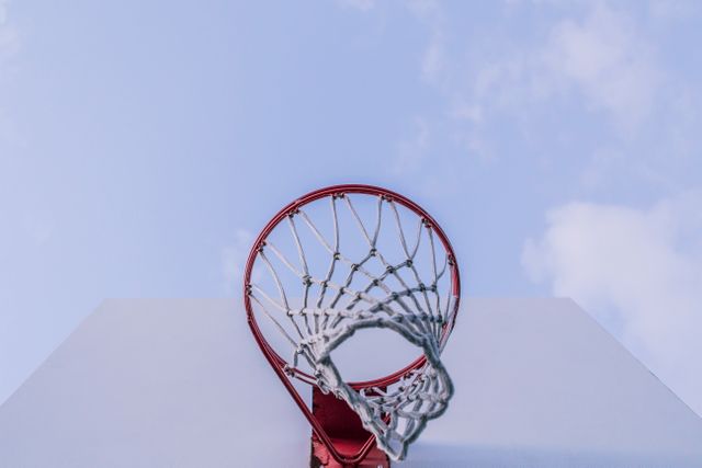 Low angle view  of basketball hoop against blue sky. Sports tournament and competition concept