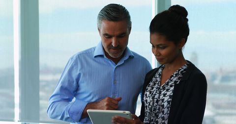 Professional Team Collaboration Over Tablet Technology in Office