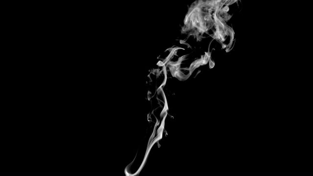 Ethereal trails of white smoke from incense create an abstract visual against a stark black background. Perfect for adding mystery, depth, and visual interest to projects involving spirituality, relaxation, meditation, or artistic concepts. Ideal for ads, posters, and illustrations requiring a sense of calm or intriguing visual texture.