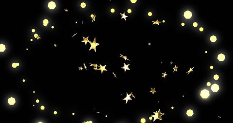 Golden stars and twinkling lights on black background
