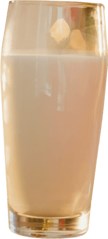 Big glass with opaque smoothie on transparent background next to accents