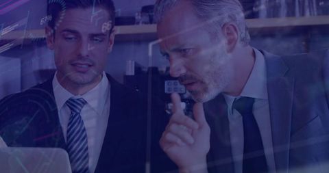 Business Leaders Analyzing Data with Digital Charts in Corporate Environment