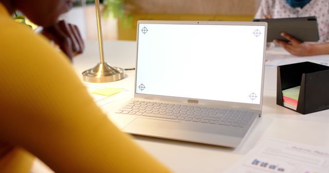 Person Working on Laptop in Bright Office Environment - Download Free Stock Images Pikwizard.com