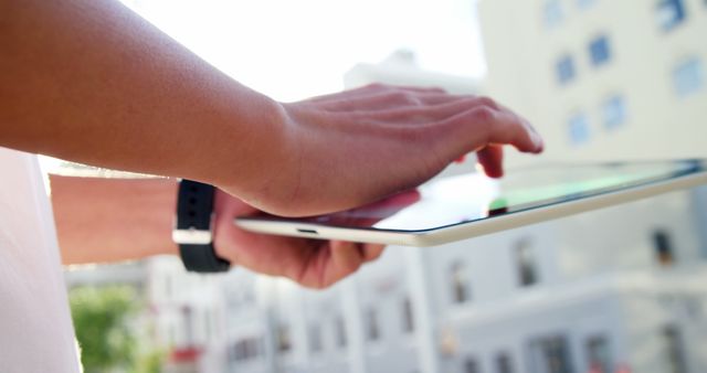 Close-up of Person Using Tablet Outdoors in Urban Area - Download Free Stock Photos Pikwizard.com