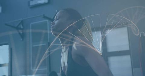 Mid-adult female athlete training hard on gym rig with motion trajectory overlay