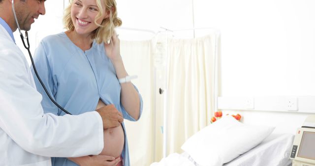 Smiling Pregnant Woman with Doctor in Hospital Room - Download Free Stock Images Pikwizard.com