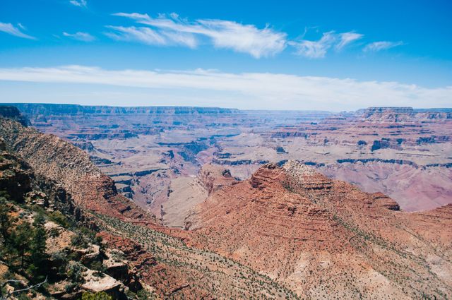 Expansive View of Grand Canyon on Clear Day with Blue Sky - Download Free Stock Photos Pikwizard.com
