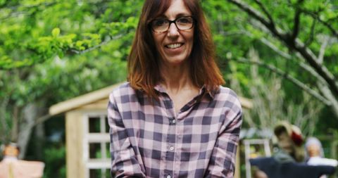 Caucasian Woman Smiling in Garden with Relaxed Atmosphere