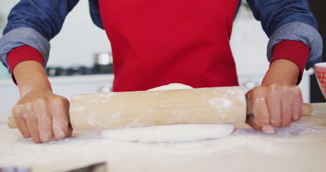 Person Rolling Dough on Floured Surface in Kitchen - Download Free Stock Images Pikwizard.com