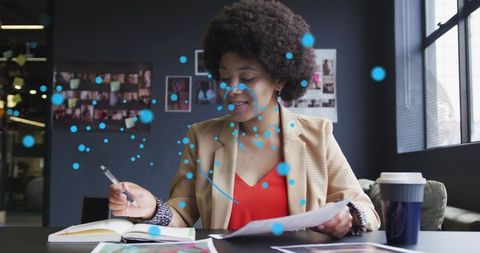 Creative professional writing and reviewing prints at modern studio desk with ar overlay