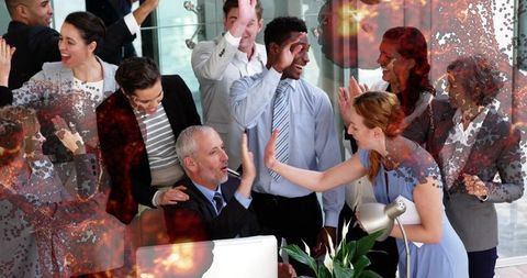 Team Celebrating Success with High-Fives at Modern Office
