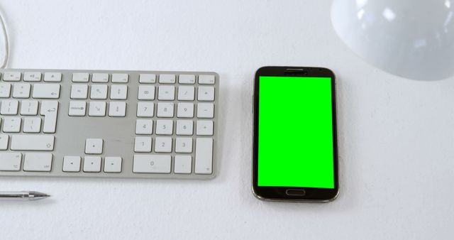 Smartphone with Green Screen on White Desk in Modern Office - Download Free Stock Images Pikwizard.com