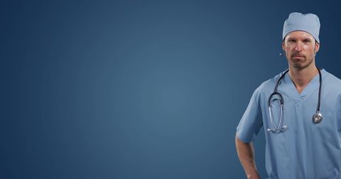 Male Surgeon in Scrubs with Stethoscope on Blue Background