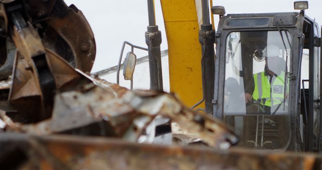 Bulldozer in scrap yard with waste and copy space - Download Free Stock Photos Pikwizard.com