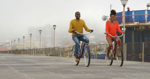 Couple Enjoying Leisurely Bike Ride on Scenic Pier - Download Free Stock Images Pikwizard.com