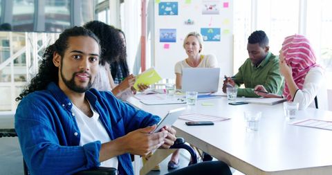 Diverse team engaging in creative office collaboration