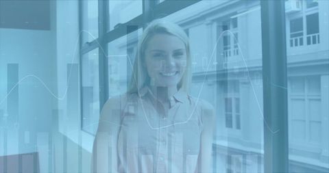 Caucasian Businesswoman Smiling with Financial Data Overlay