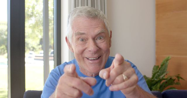 Senior Man Smiling and Pointing at Camera in Cheerful Pose - Download Free Stock Images Pikwizard.com