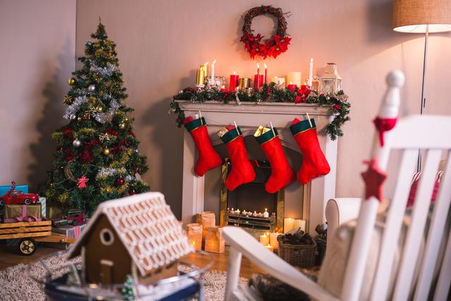 Cozy Christmas Living Room with Decorated Fireplace and Christmas Tree - Download Free Stock Photos Pikwizard.com