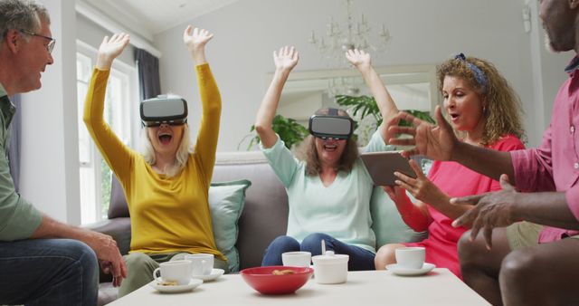 Image of happy diverse female and male senior friends using vr headset and having fun - Download Free Stock Photos Pikwizard.com