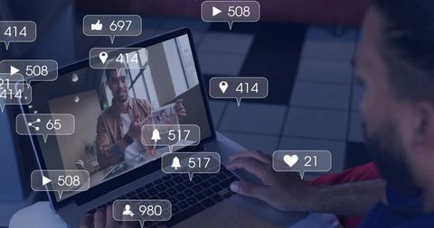 Presenter livestreaming holding framed portrait on laptop with social media notifications