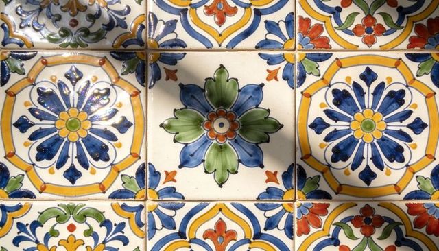 Glazed talavera ceramic tiles featuring colorful hand-painted floral rosette pattern