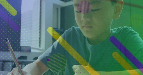 Child engaged in homework writing at home in creative environment