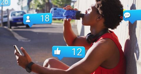 Man Engaged With Social Media While Hydrating on Run - Download Free Stock Images Pikwizard.com
