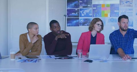 Business Team Analyzing Data During Interactive Meeting