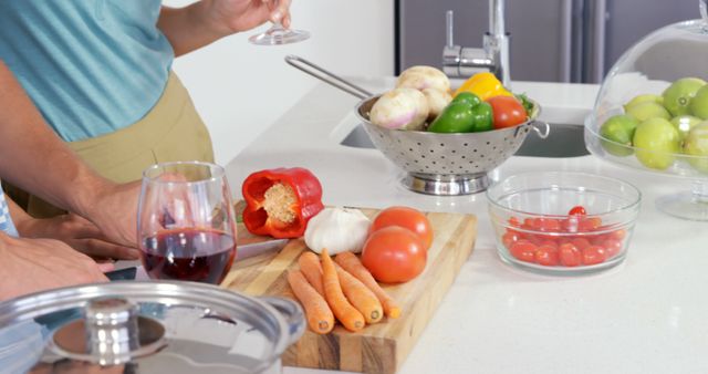 Preparing Vegetables in Modern Kitchen with Wine and Fresh Produce - Download Free Stock Images Pikwizard.com