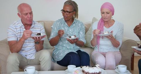 Senior Friends Enjoying Cake and Coffee Together