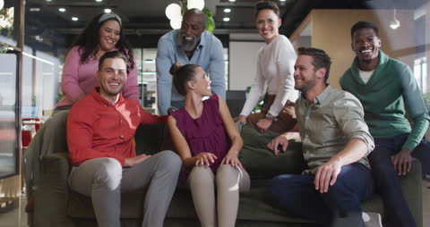 Diverse Business Team Smiling in Modern Office Setting