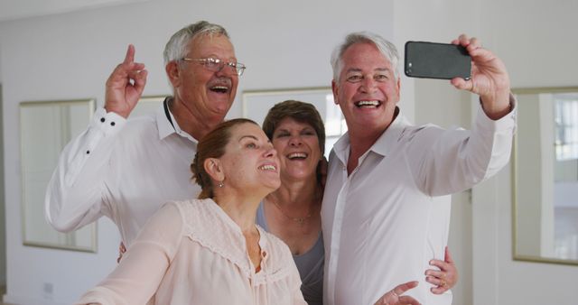 Happy Senior Friends Taking a Selfie Indoors - Download Free Stock Images Pikwizard.com