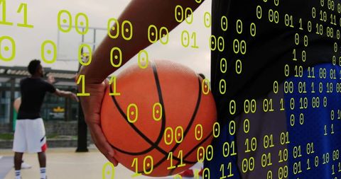 Athletic Player Holding Basketball with Digital Binary Overlay