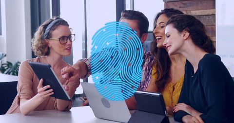 Diverse team collaborating on biometric security project with digital fingerprint overlay