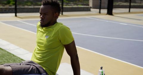 Basketball Player Taking Break on Outdoor Court - Download Free Stock Images Pikwizard.com