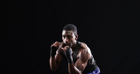 Focused Athlete in Boxing Stance Demonstrating Intense Training Session