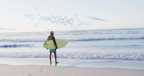 Surfer Holding Surfboard Looking at Ocean