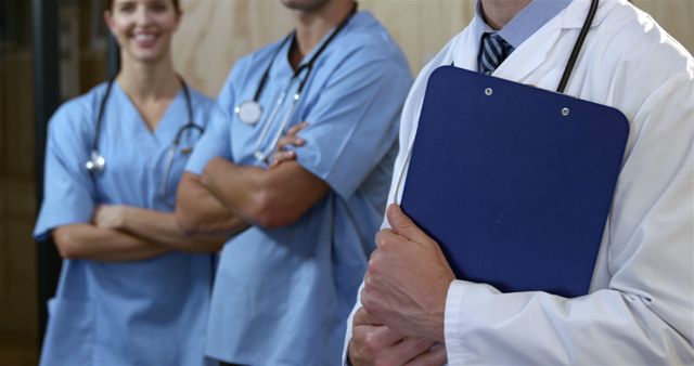 Healthcare Professionals Standing with Clipboard - Download Free Stock Images Pikwizard.com