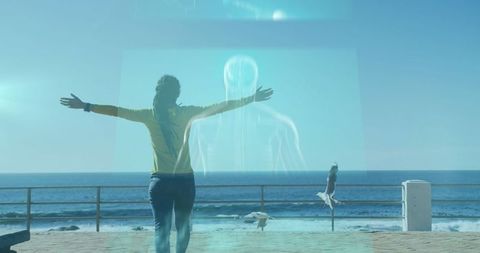 Woman embracing digital interface by sea promenade