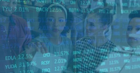 Business team analyzing stock data on interactive screen