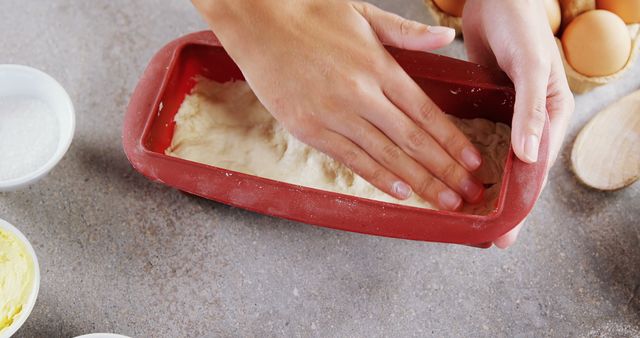 Hands Flattening Dough in Red Silicone Baking Pan - Download Free Stock Images Pikwizard.com