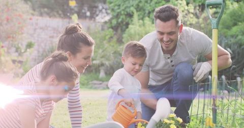 Joyful Family Gardening Together on a Sunny Day