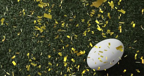 Festive Rugby Celebration with White Ball and Gold Confetti - Download Free Stock Images Pikwizard.com
